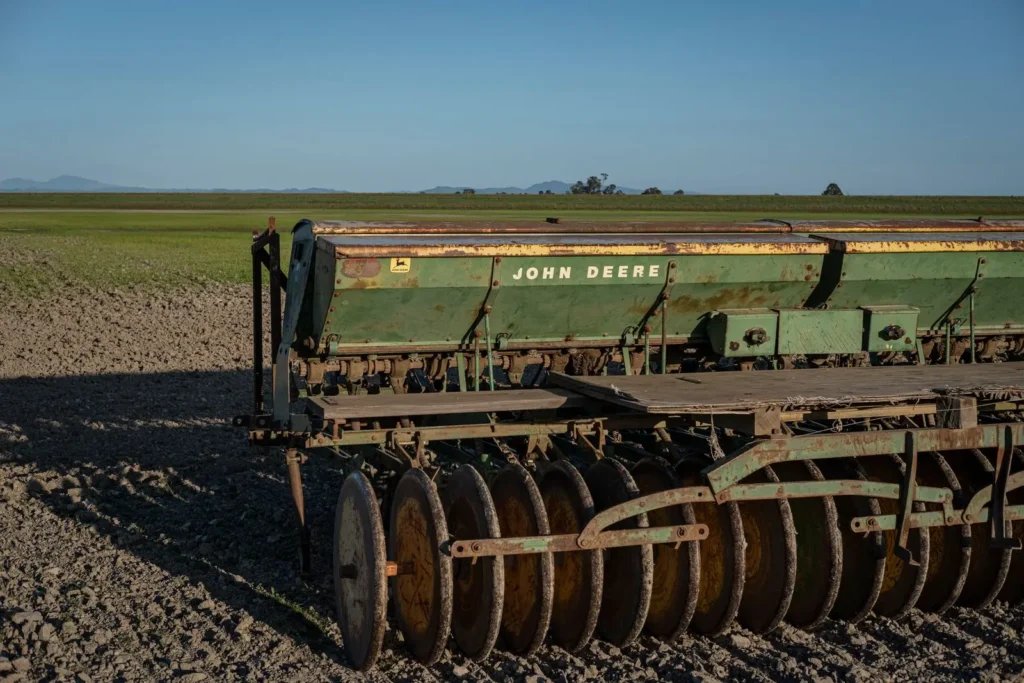 Seed drill standing in a cultivated field