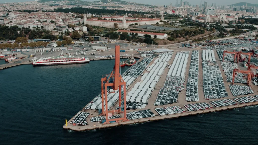 Aerial view of vehicles staged for shipping at a port terminal