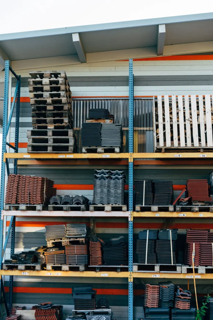 Construction materials stacked on racks at a supply store