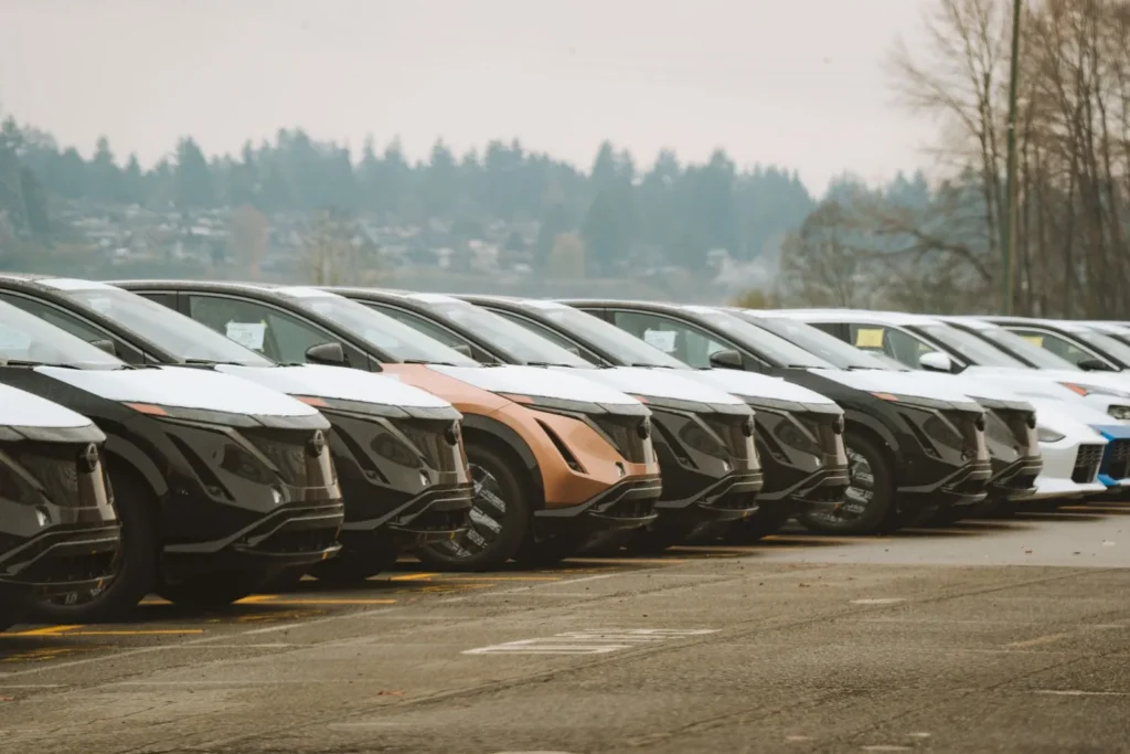 Line of modern electric cars parked together outdoors