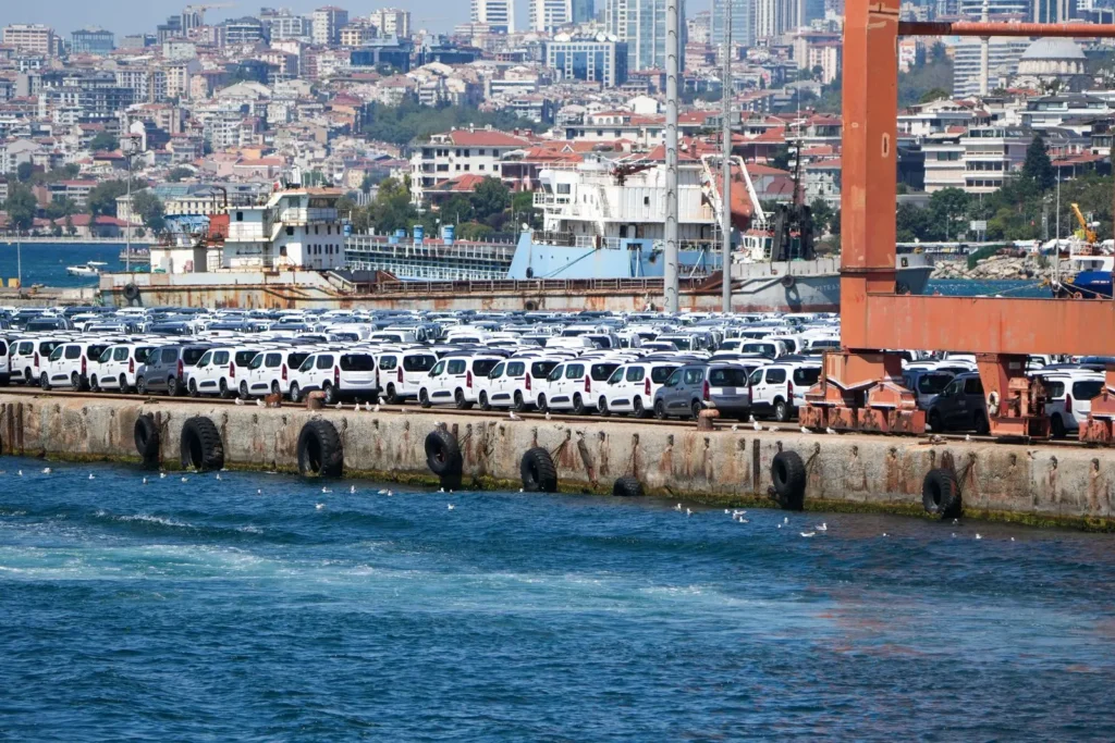 Rows of vans staged at a maritime vehicle terminal