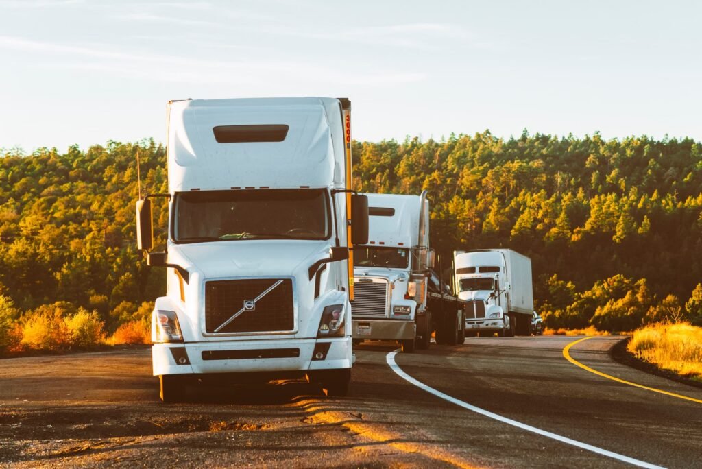 Semi-trucks traveling on a highway in the United States