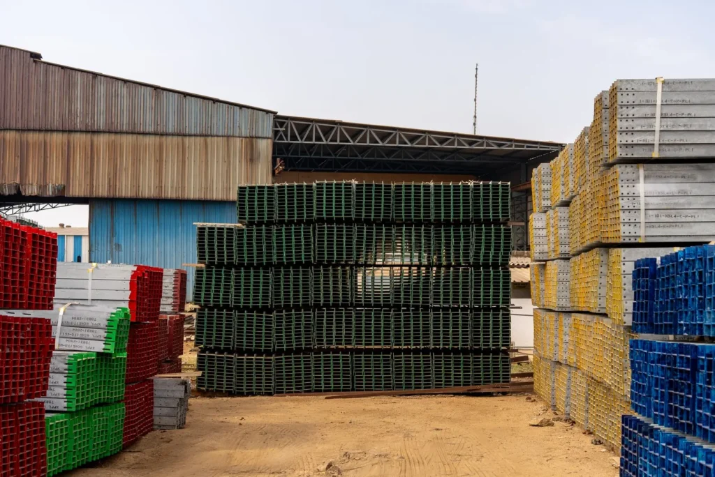 Stacks of construction materials in an outdoor storage yard