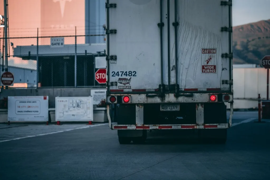 Rear of an enclosed freight trailer at a facility gate