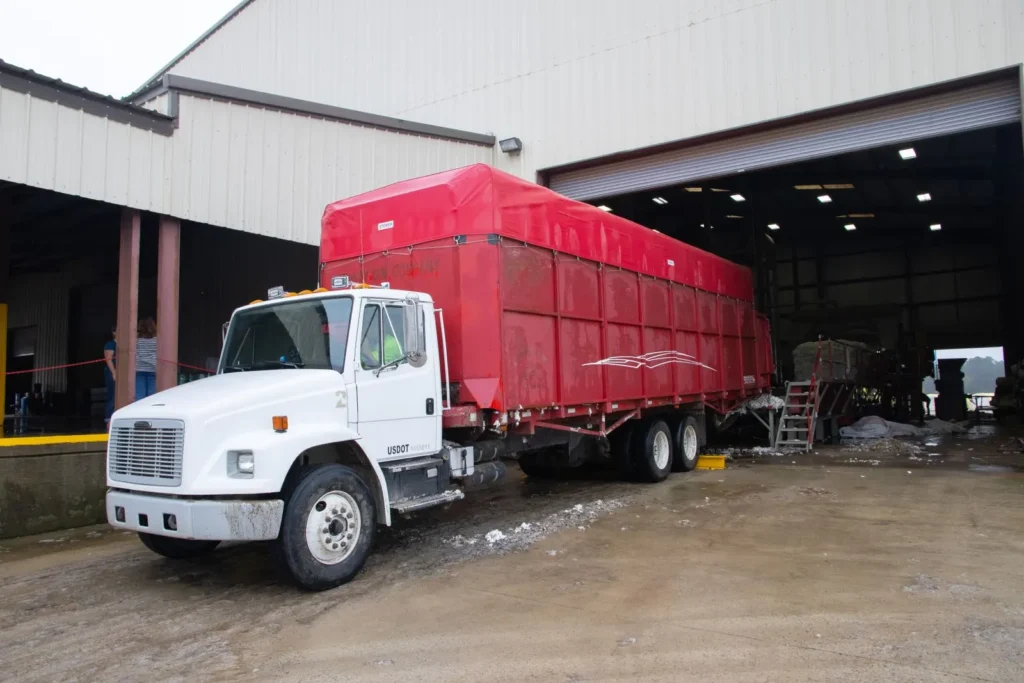 Red freight trailer at a warehouse loading dock