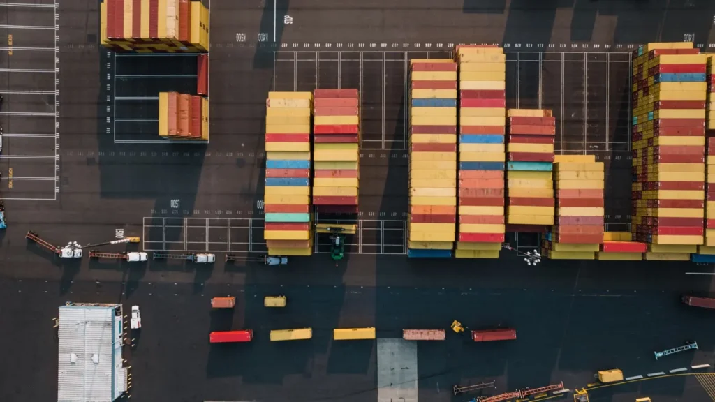 Aerial view of stacked shipping containers at a port terminal