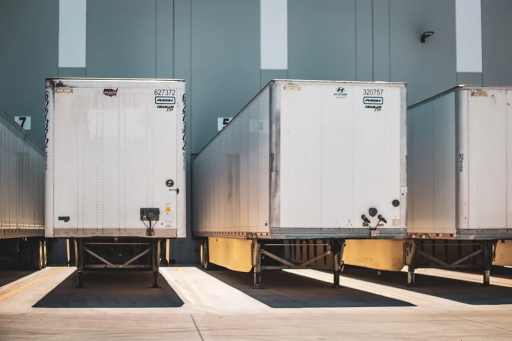 Freight trailers parked at warehouse loading bays